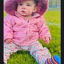 toddler, child, pink_jacket, hood, mouse_ears, grass, outdoor, clouds, sky, colorful_socks, striped_socks, floral_pants, cute, winter_clothing, baby, portrait, sitting, daylight, nature, young_child