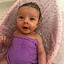baby, infant, bath, purple_towel, pink_bathtub_seat, water, wet_hair, cute, child, skin, expression, small_baby, sitting, indoors, face, looking_up, wrapped, soft, comfort, adorable