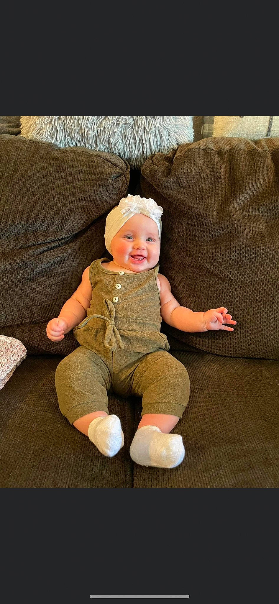 Meredith joined the competition — help win amazing prizes! baby, baby_toddler_clothing, cheek, comfort, couch, eye, face, foot, fun, happy, head, headwear, human_body, human_leg, joy, knee, leg, person, sitting, sleeve