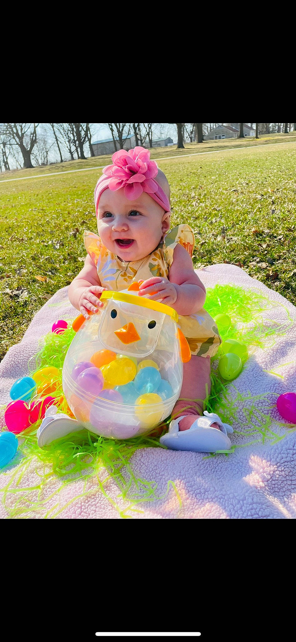 Meredith joined the competition — help win amazing prizes! baby, baby_products, baby_toddler_clothing, child, dress, fun, grass, green, happy, headwear, leisure, pattern, person, pink, plant, recreation, sitting, smile, textile, toddler