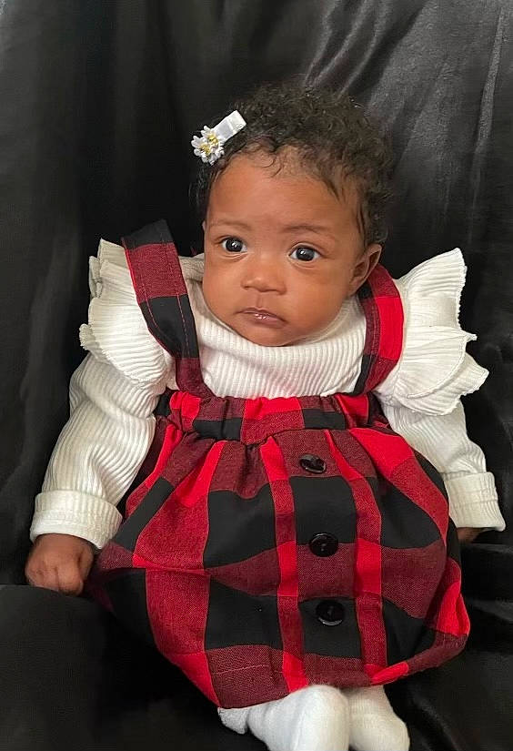 Kaylie is registered to the contest to win money with this photo: baby, baby_toddler_clothing, cheek, child, costume, day_dress, dress, eye, eyelash, formal_wear, hair, lip, one_piece_garment, pattern, person, pink, plaid, skin, sleeve, tartan