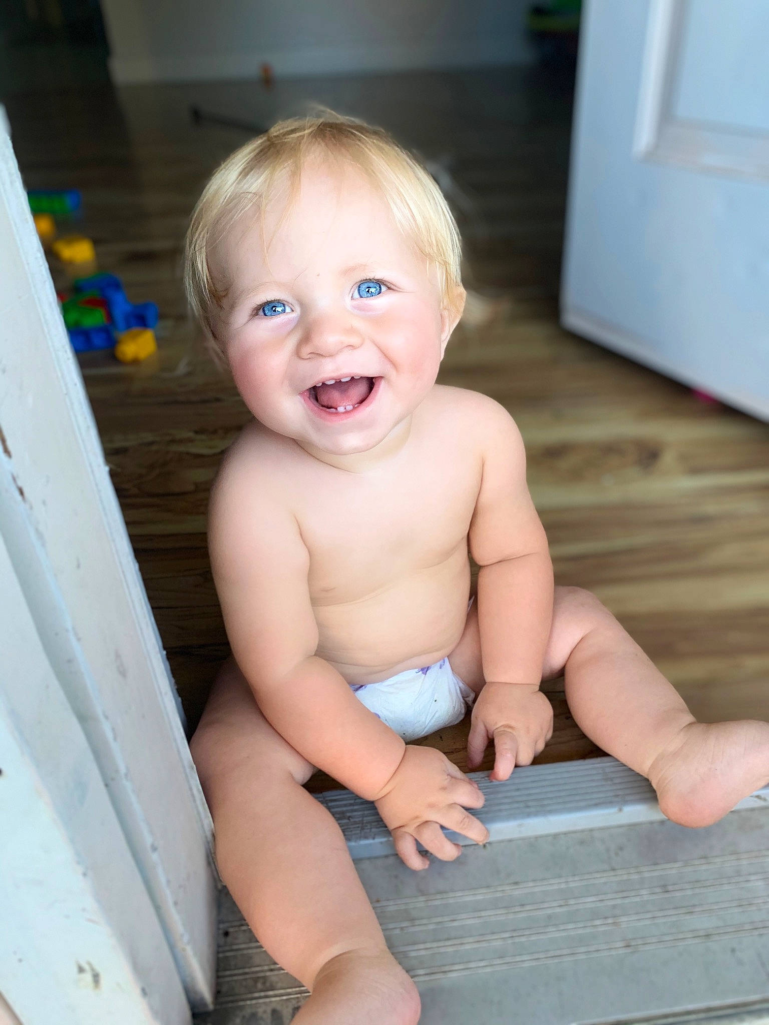 Jaxton joined the competition — help win amazing prizes! baby, blond, cheek, chest, chin, eye, finger, flooring, fun, happy, head, human_body, iris, joy, person, sitting, skin, smile, thigh, thumb