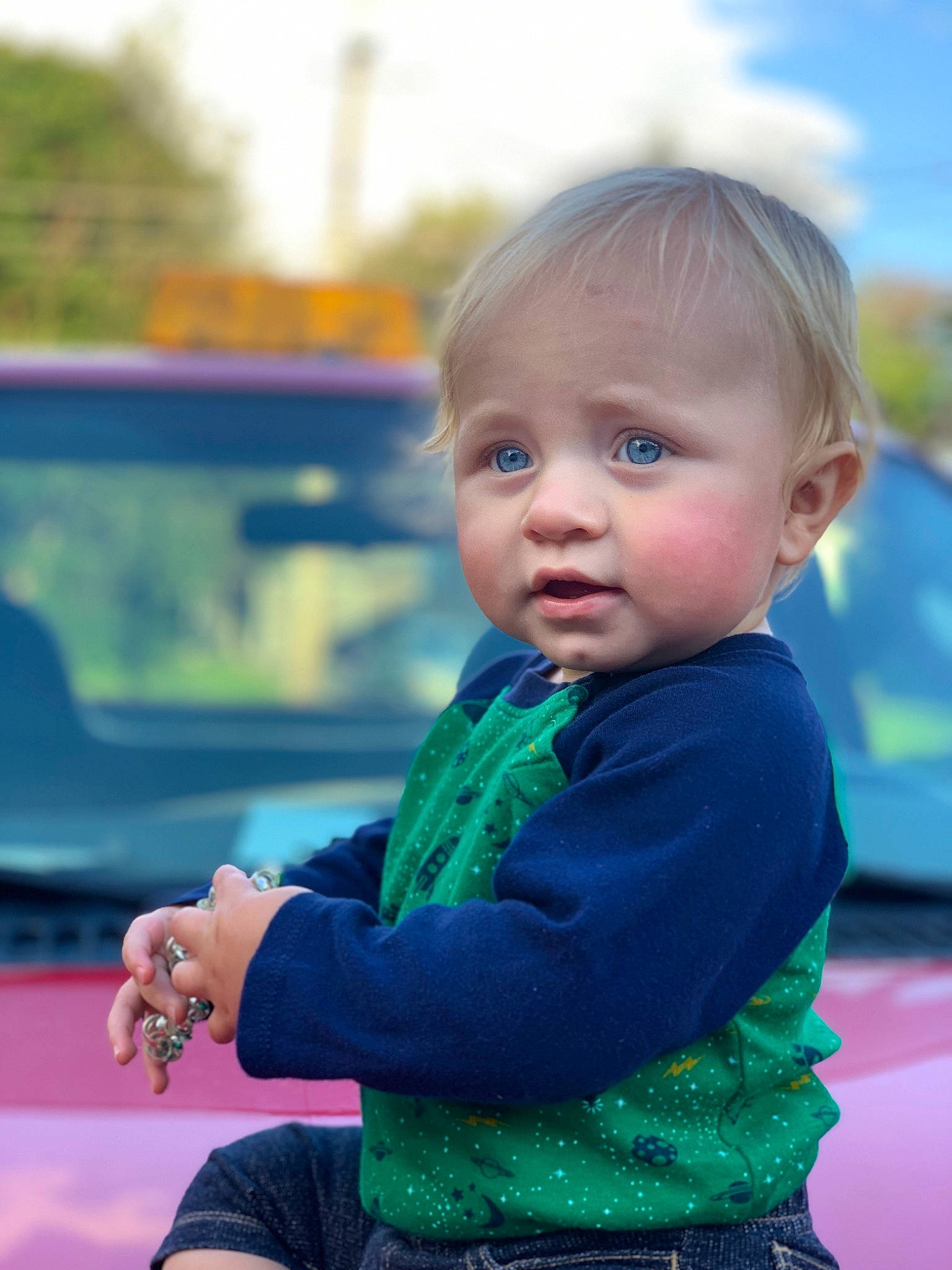 Jaxton joined the competition — help win amazing prizes! automotive_exterior, azure, baby, baby_toddler_clothing, car, child, electric_blue, family_car, fun, grass, happy, leisure, motor_vehicle, person, recreation, sitting, sky, smile, t_shirt, toddler