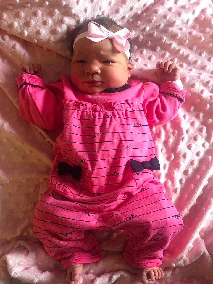 Ashlynne is registered to the contest to win money with this photo: baby, baby_products, baby_toddler_clothing, cap, cheek, child, fashion_accessory, happy, head, linens, magenta, pattern, peach, person, pink, purple, skin, sleeve, smile, toddler