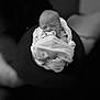 newborn, baby, pacifier, blanket, swaddled, sleeping, infant, black_and_white, soft_focus, cozy, cute, child, peaceful, wrapped, portrait, indoors, resting, tender, star_pattern, young