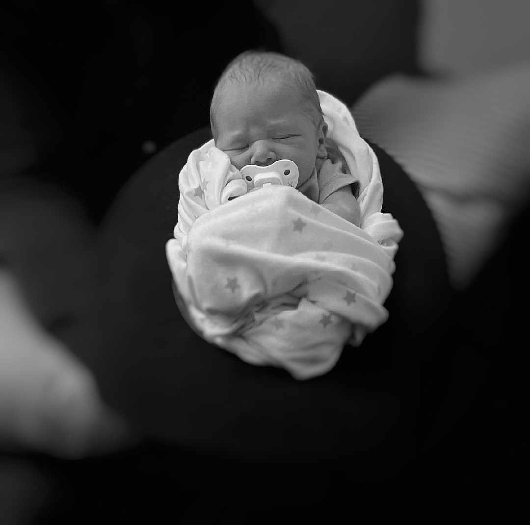 Ellija joined the competition — help win amazing prizes! newborn, baby, pacifier, blanket, swaddled, sleeping, infant, black_and_white, soft_focus, cozy, cute, child, peaceful, wrapped, portrait, indoors, resting, tender, star_pattern, young