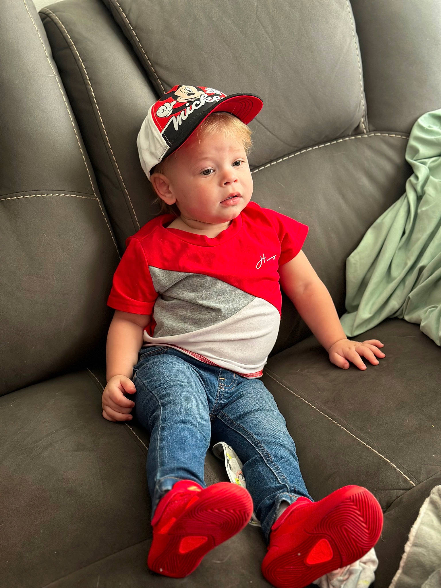 Cyrus joined the competition — help win amazing prizes! baby_toddler_clothing, cap, carmine, child, comfort, costume_hat, fashion_accessory, flash_photography, flooring, foot, happy, hat, headwear, human_leg, lap, leg, person, red, sitting, sleeve