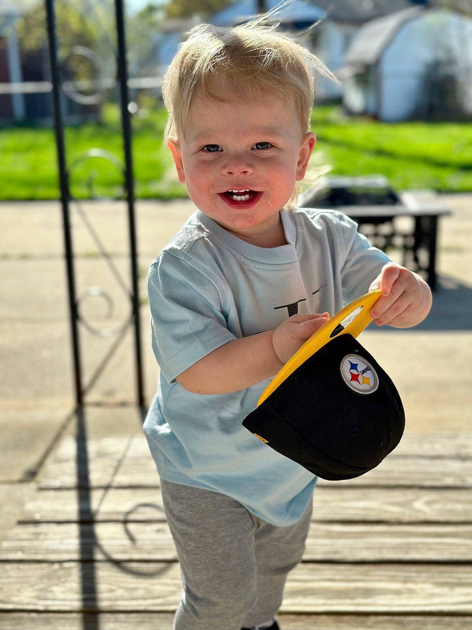 Cyrus joined the competition — help win amazing prizes! baby, baby_toddler_clothing, child, city, denim, fun, grass, happy, leisure, pattern, person, plant, play, recreation, sitting, sleeve, smile, t_shirt, toddler, tree