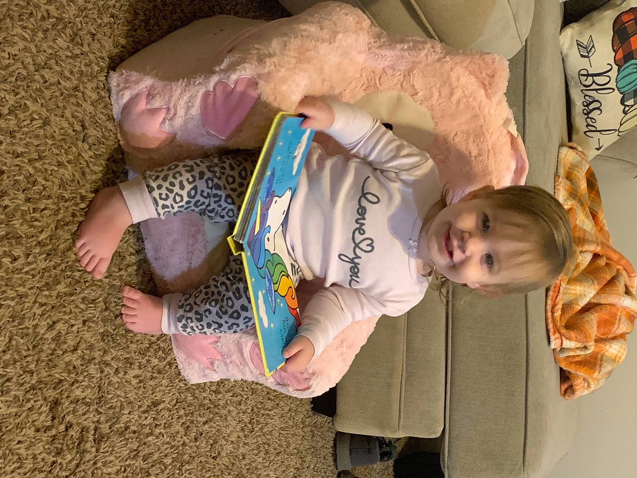 Emberly is registered to the contest to win money with this photo: baby, baby_products, baby_toddler_clothing, child, comfort, eye, facial_expression, fun, happy, human_body, joy, linens, person, play, room, sitting, toddler, tree, vacation, vertebrate