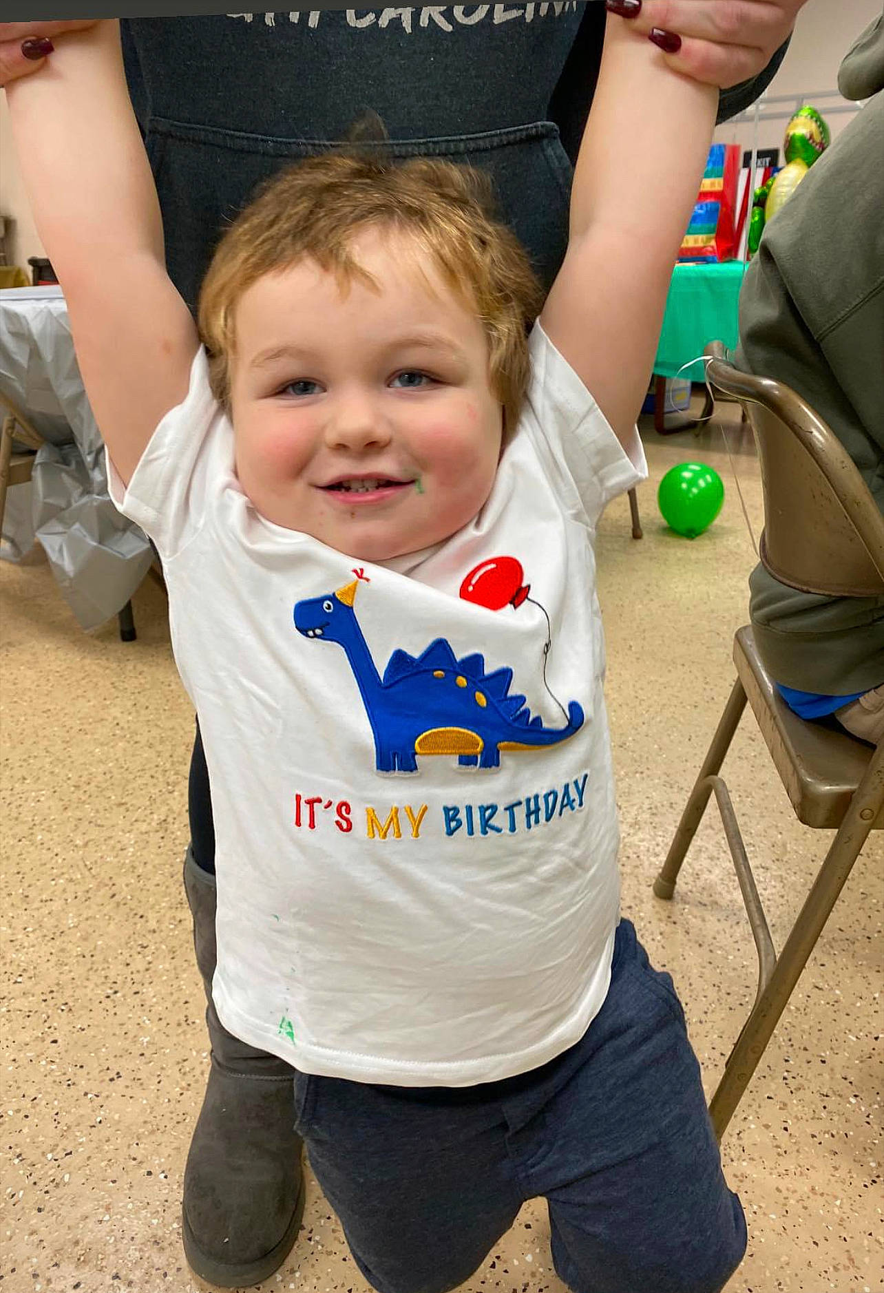 Carter is registered to the contest to win money with this photo: baby, baby_toddler_clothing, child, cool, electric_blue, event, fun, gesture, hairstyle, happy, joy, leisure, logo, person, recreation, sleeve, smile, sportswear, t_shirt, toddler