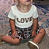 Gypsy joined the competition — help win amazing prizes! carpet, casual_clothing, child, curious, cute, expression, floor, footwear, indoor, indoors, looking_away, love_text, patterned_carpet, person, plaid_skirt, shirt, sitting, small_child, toddler, young_child