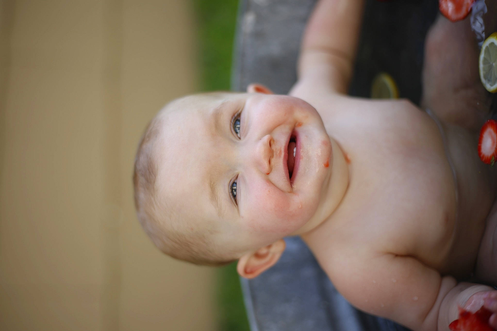 Josie is registered to the contest to win money with this photo: arm, baby, baby_laughing, cheek, chin, eye, eyebrow, flash_photography, gesture, grass, happy, human_body, iris, joy, lip, mouth, neck, nose, person, skin
