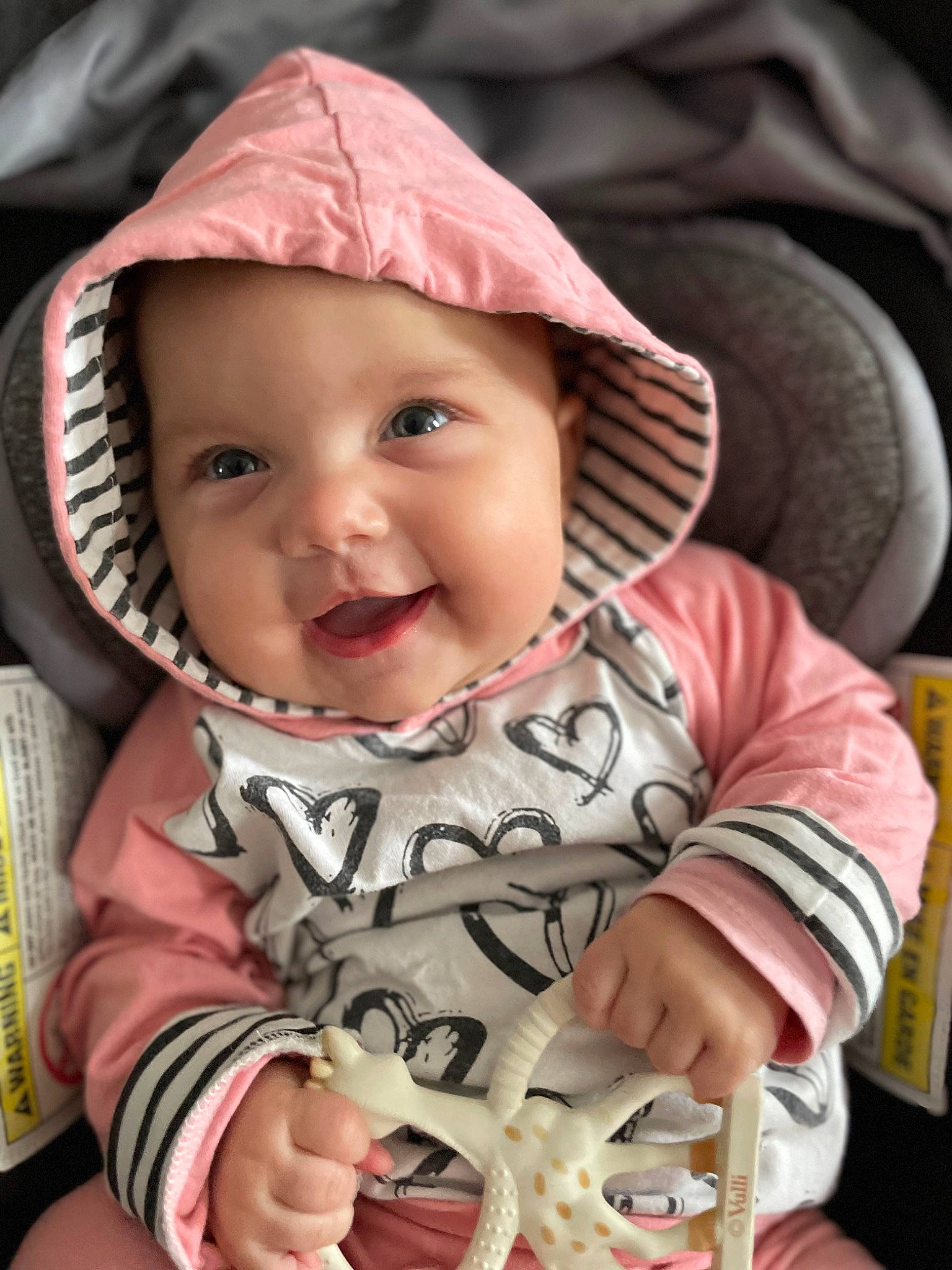 Eleanor joined the competition — help win amazing prizes! baby_toddler_clothing, cheek, chin, clothing, eye, face, facial_expression, hand, head, headwear, iris, lip, mouth, nose, person, product, skin, sleeve, smile, textile