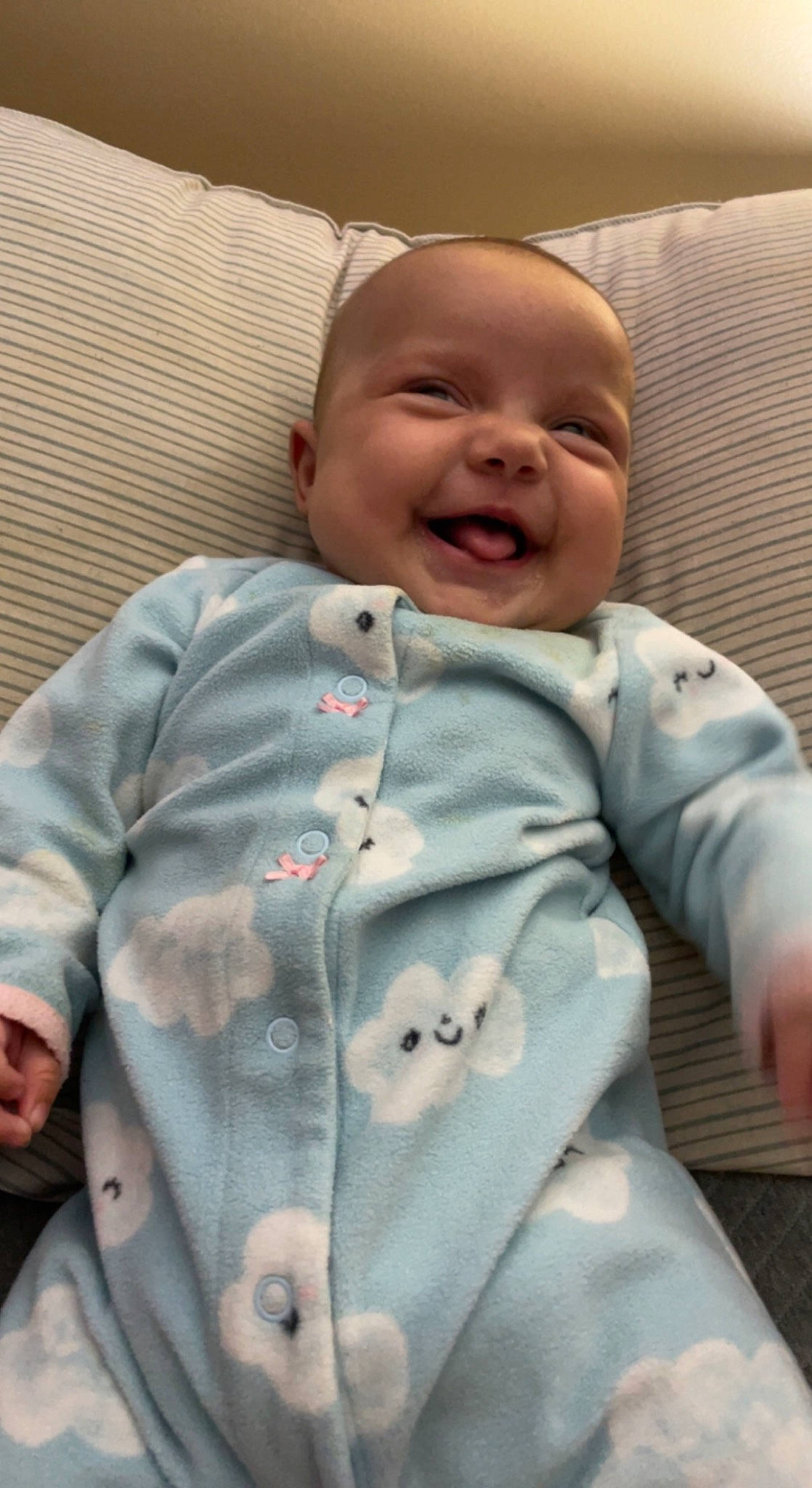 Eleanor is registered to the contest to win money with this photo: baby, baby_laughing, baby_products, baby_toddler_clothing, cheek, child, collar, comfort, facial_expression, finger, happy, linens, mouth, nose, person, skin, sleeve, smile, standing, textile
