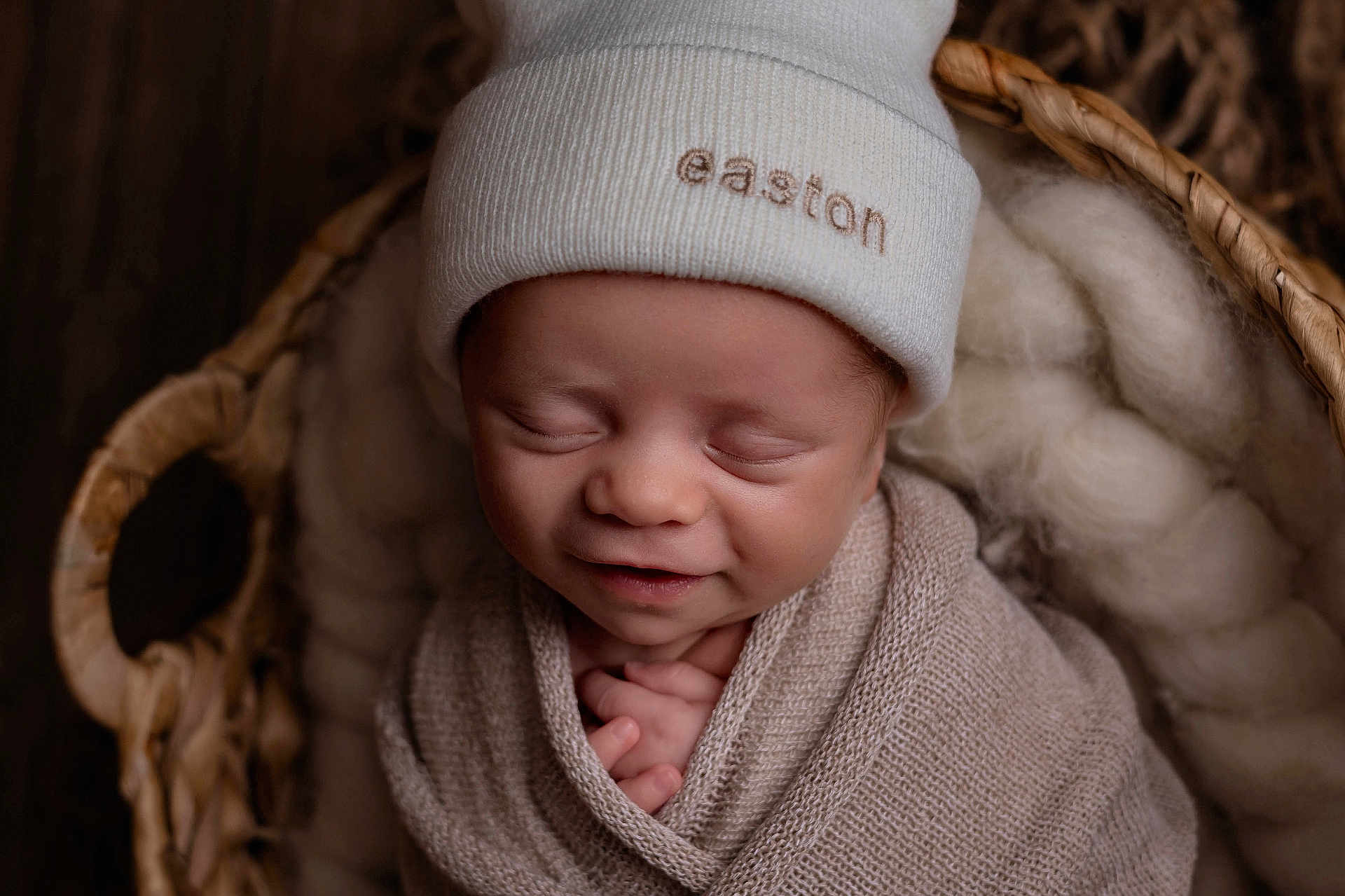 Easton is registered to the contest to win money with this photo: newborn, baby, sleeping, hat, blanket, basket, wool, cozy, smile, face, wrapped, soft, cute, infant, peaceful, portrait, closeup, child, headwear, resting