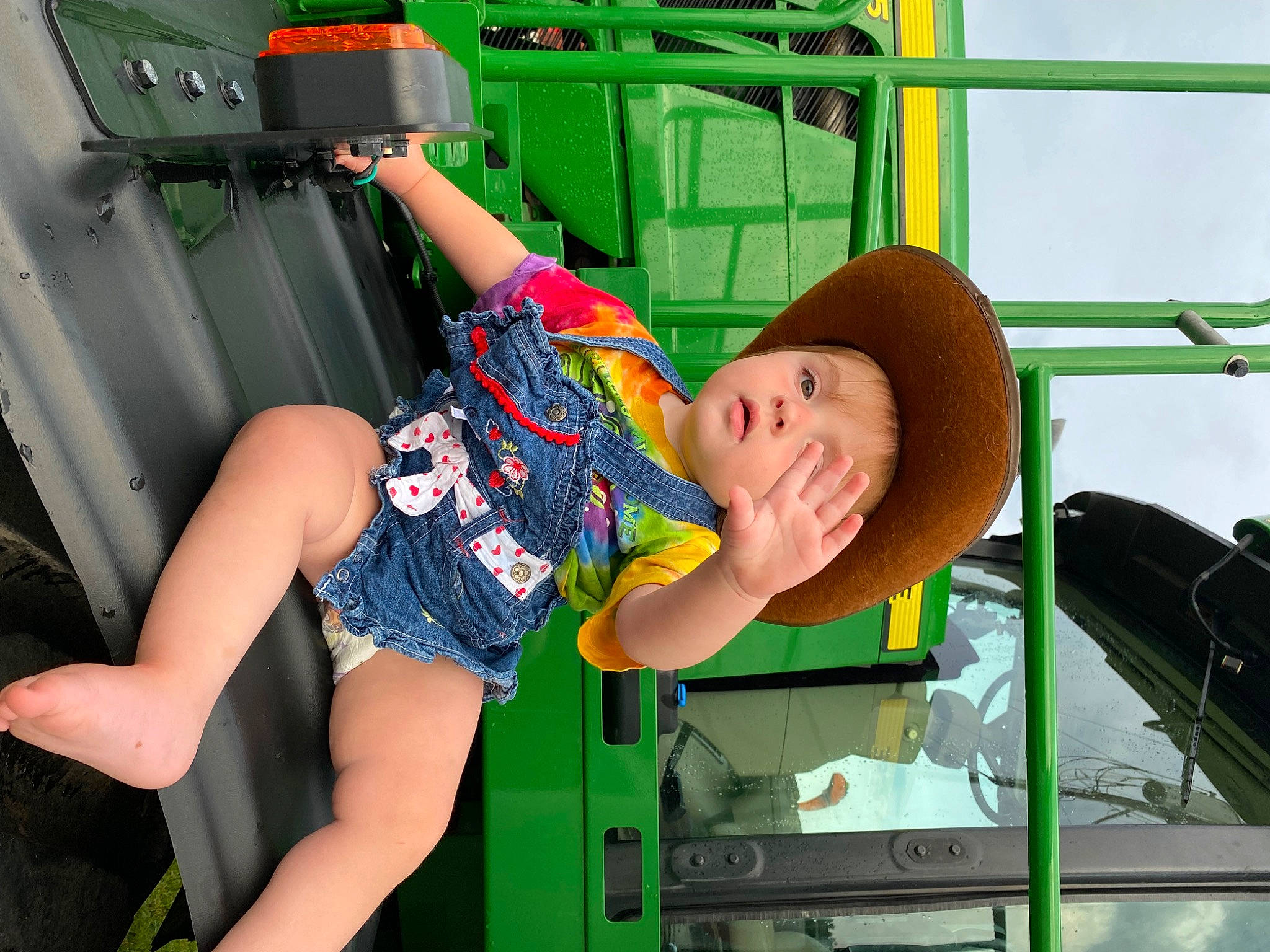 Emberlyn is registered to the contest to win money with this photo: auto_part, calf, chair, child, fun, hat, human_leg, knee, leisure, motor_vehicle, person, physical_fitness, sandal, shorts, sitting, t_shirt, thigh, transport, vacation, vehicle_door