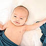 baby, infant, smile, arm, blanket, blue_blanket, skin, lying_down, soft_light, white_background, happy, cute, peaceful, portrait, child, newborn, indoors, resting, baby_face, bare_chest