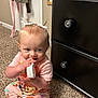 baby, child, pajamas, carpet, brush, hair_bows, dresser, furniture, indoor, cute, sitting, playing, infant, floor, person, carpeted_floor, toy, knobs, room, colorful_clothing