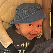 Oscar joined the competition — help win amazing prizes! baby, blue_hat, car_seat, child, smiling, blanket, seatbelt, close_up, infant, face, headwear, cute, happy, indoors, child_seat, clothing, person, portrait, safety, comfort