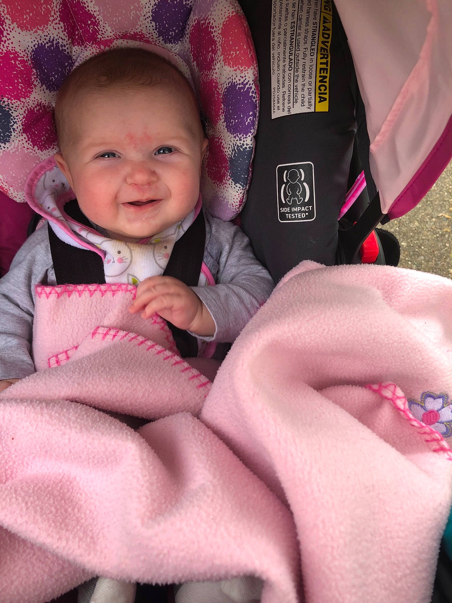 Olivia is registered to the contest to win money with this photo: baby, baby_carriage, baby_in_car_seat, baby_products, car_seat, cheek, child, face, fun, head, lip, magenta, person, pink, product, skin, smile, toddler