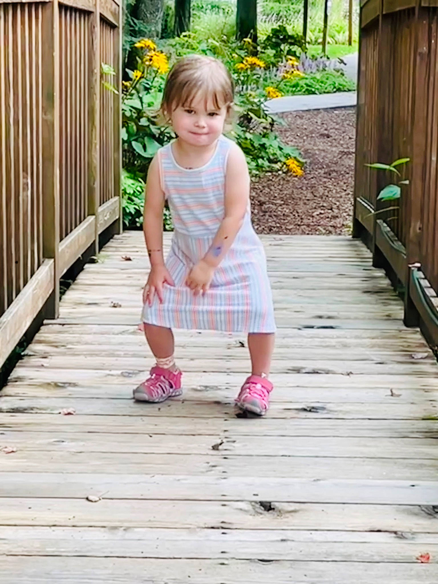 Eliza joined the competition — help win amazing prizes! baby_toddler_clothing, door, flooring, flower, footwear, grass, green, happy, hardwood, leaf, leg, leisure, people_in_nature, person, pink, plant, summer, toddler, tree, wood