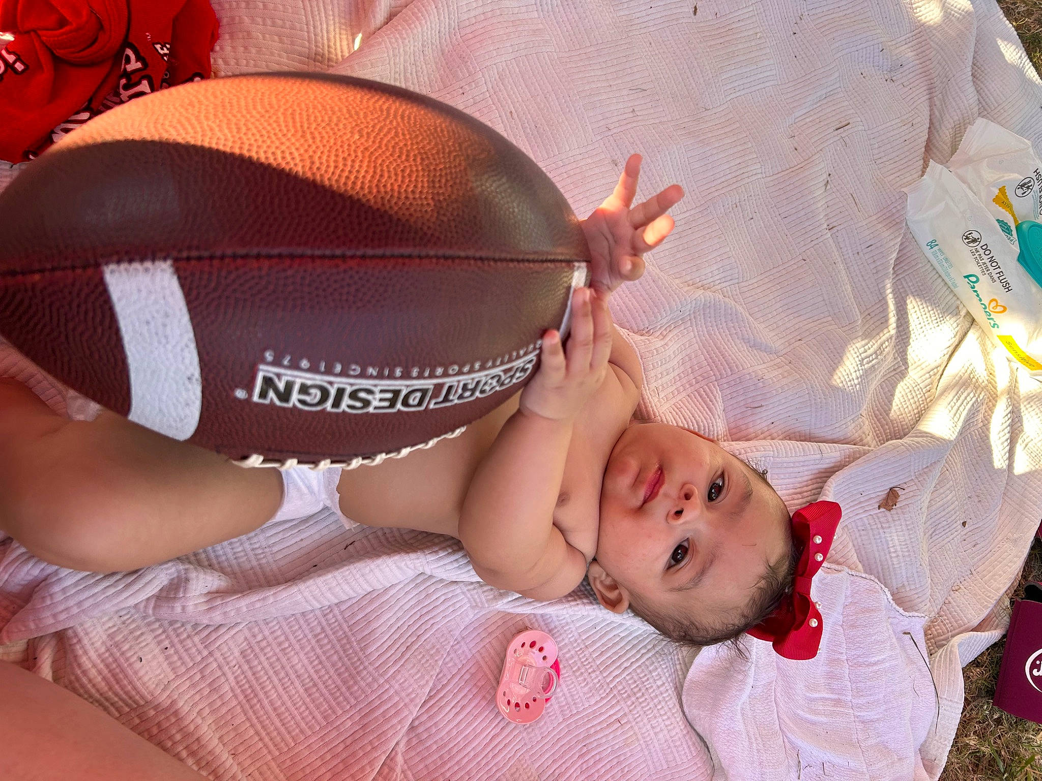 Haven joined the competition — help win amazing prizes! baby, baby_products, baby_sleeping, baby_toddler_clothing, ball, child, comfort, face, fashion_accessory, grass, happy, head, headgear, pattern, person, personal_protective_equipment, pink, sitting, sunglasses, textile