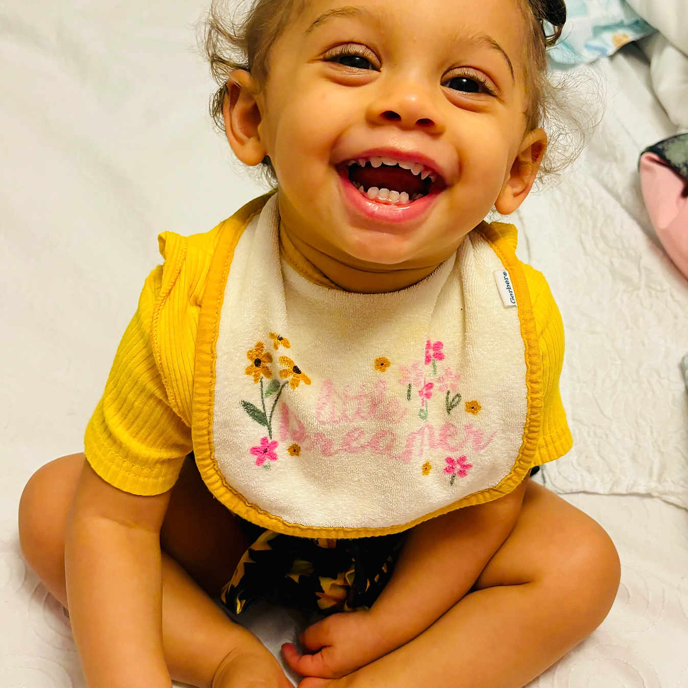 Amora Johnson joined the competition — help win amazing prizes! accessories, baby, babylaughing, bodypart, clothing, face, finger, furniture, glasses, hand, happy, head, laughing, mouth, person, photography, portrait, sitting, smile, teeth