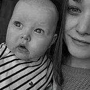 Lou participe au concours pour gagner de l'argent avec cette photo : baby, child, woman, face, portrait, black_and_white, striped_clothing, heart_symbol, smile, curious, closeup, indoor, person, sweater, head, expression, young_adult, bonding, monochrome, nose_ring
