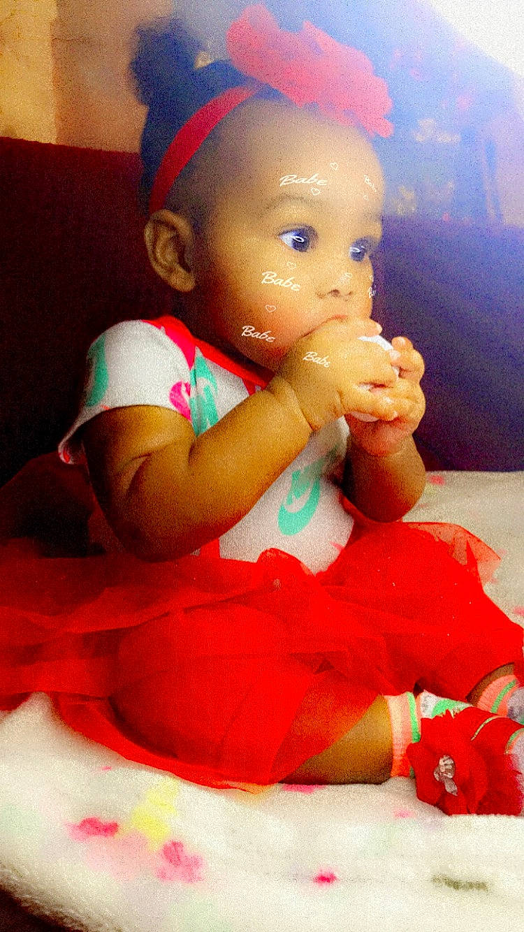 Jayani joined the competition — help win amazing prizes! baby_toddler_clothing, cheek, child, doll, event, fictional_character, finger, fun, gesture, hairstyle, happy, head, lap, nail, person, pink, red, thigh, thumb, toddler