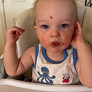 Lucas is registered to the contest to win money with this photo: toddler, child, messy_face, high_chair, indoor, curious, blue_eyes, tank_top, food_stains, wild_hair, cute, playful, baby, seat, feeding_time, expression, person, young_child, casual_clothing, portrait
