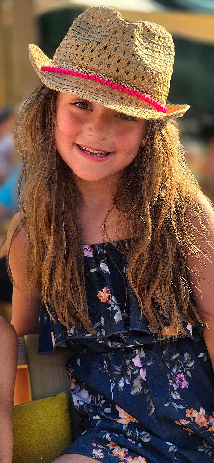 Charlotte participe au concours pour gagner de l'argent avec cette photo : child, girl, smiling, hat, straw_hat, long_hair, floral_dress, outdoor, sunlight, portrait, happy, fashion, summer, casual_clothing, face, person, cute, natural_light, closeup, young