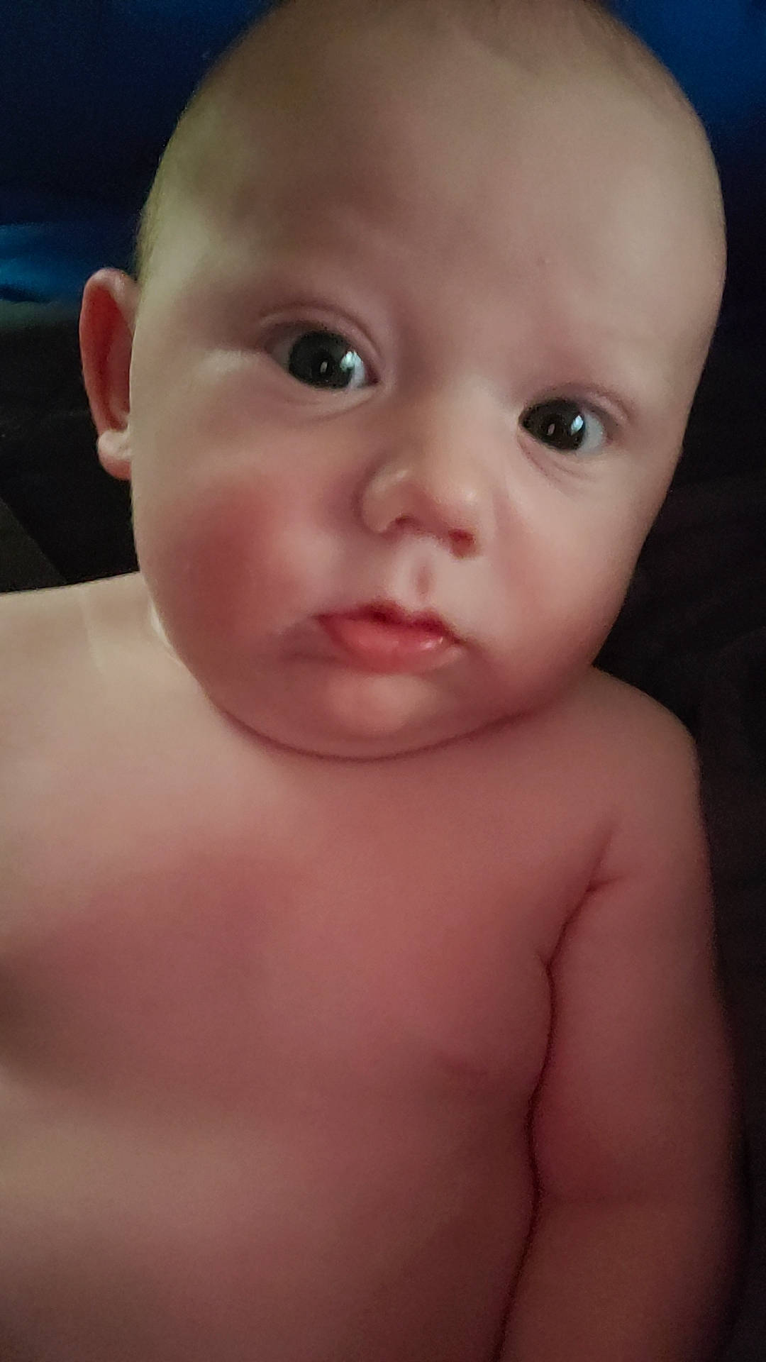 Reid is registered to the contest to win money with this photo: baby, cheek, chest, ear, eye, eyelash, finger, human_body, iris, jaw, lip, mammal, mouth, neck, no_expression, nose, person, skin, throat, thumb