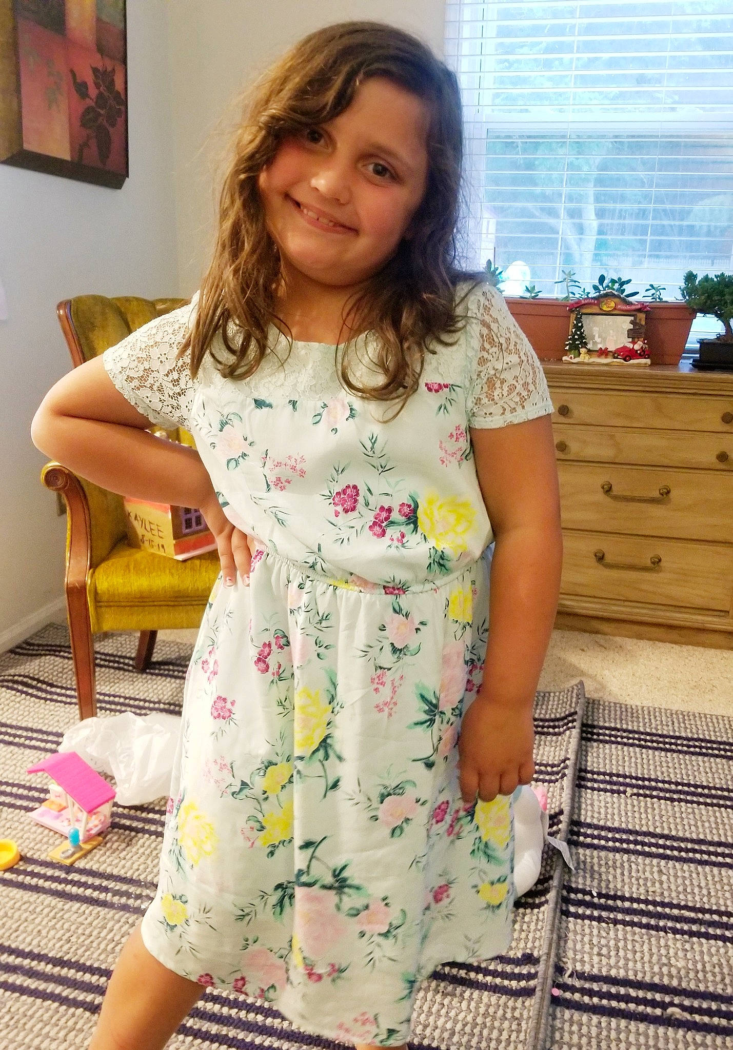 Kaylee is registered to the contest to win money with this photo: cabinetry, chest_of_drawers, chiffonier, curtain, day_dress, drawer, dress, dresser, flooring, home, houseplant, interior_design, joy, one_piece_garment, pattern, person, picture_frame, room, sideboard, window_blind