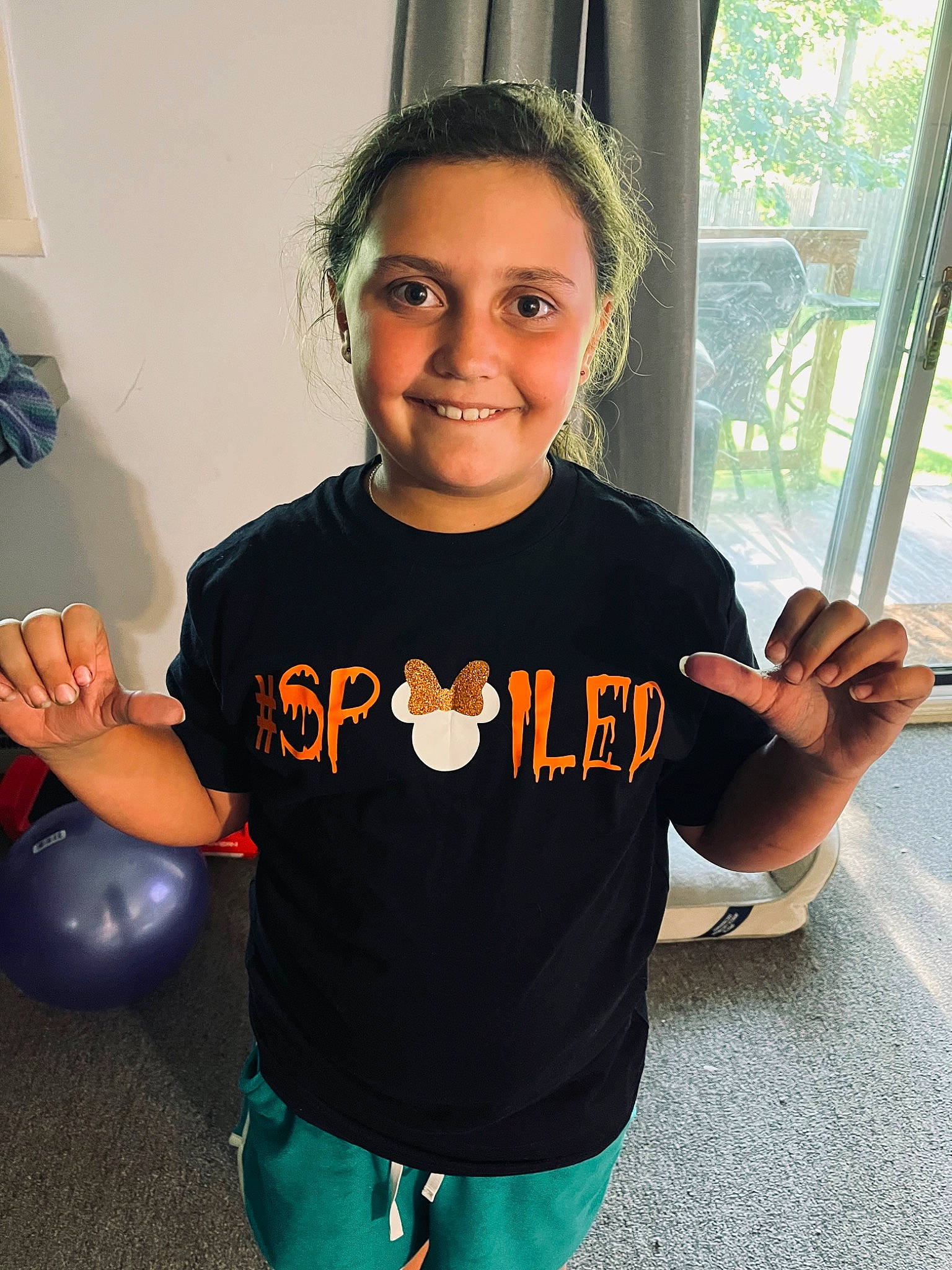 Kaylee is registered to the contest to win money with this photo: cool, curtain, eye, facial_expression, finger, gesture, hair, happy, head, joint, joy, muscle, neck, organ, person, shoulder, sleeve, smile, standing, t_shirt