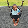baby, child, toddler, swing, playground, smiling, happy, portrait, outdoor, playground_surface, grass, bib, blue_shirt, barefoot, swing_chains, seated, infant, face, playtime, lawn