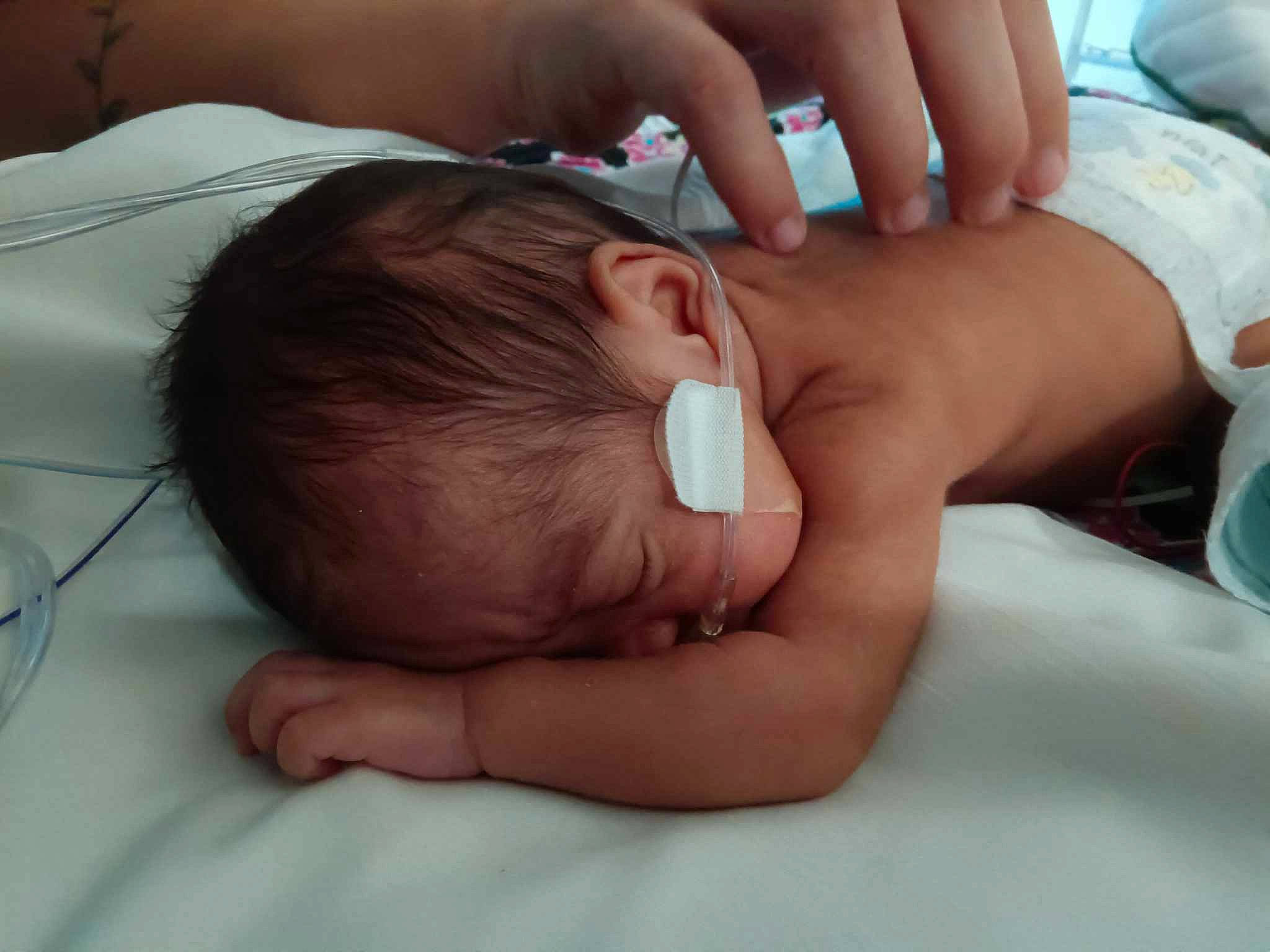 Kiara is registered to the contest to win money with this photo: baby, baby_toddler_clothing, cheek, child, close_up, comfort, elbow, finger, flesh, foot, gesture, happy, human_leg, mouth, nail, nose, person, skin, thumb, toddler