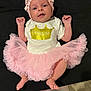 Kamila a rejoint le concours — aidez-le/la à gagner de superbes lots ! baby, infant, tutu, pink, headband, smile, cute, dress, clothing, portrait, child, person, happy, face, baby_girl, laying_down, fabric, adorable, soft, newborn