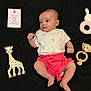Kamila participe au concours pour gagner de l'argent avec cette photo : adorable, baby, black_blanket, child, colorful, cute, giraffe_toy, indoors, infant, knitted_bear_toy, looking_sideways, lying_down, newborn, pink_shorts, playful, portrait, small, soft_toys, two_months, white_shirt