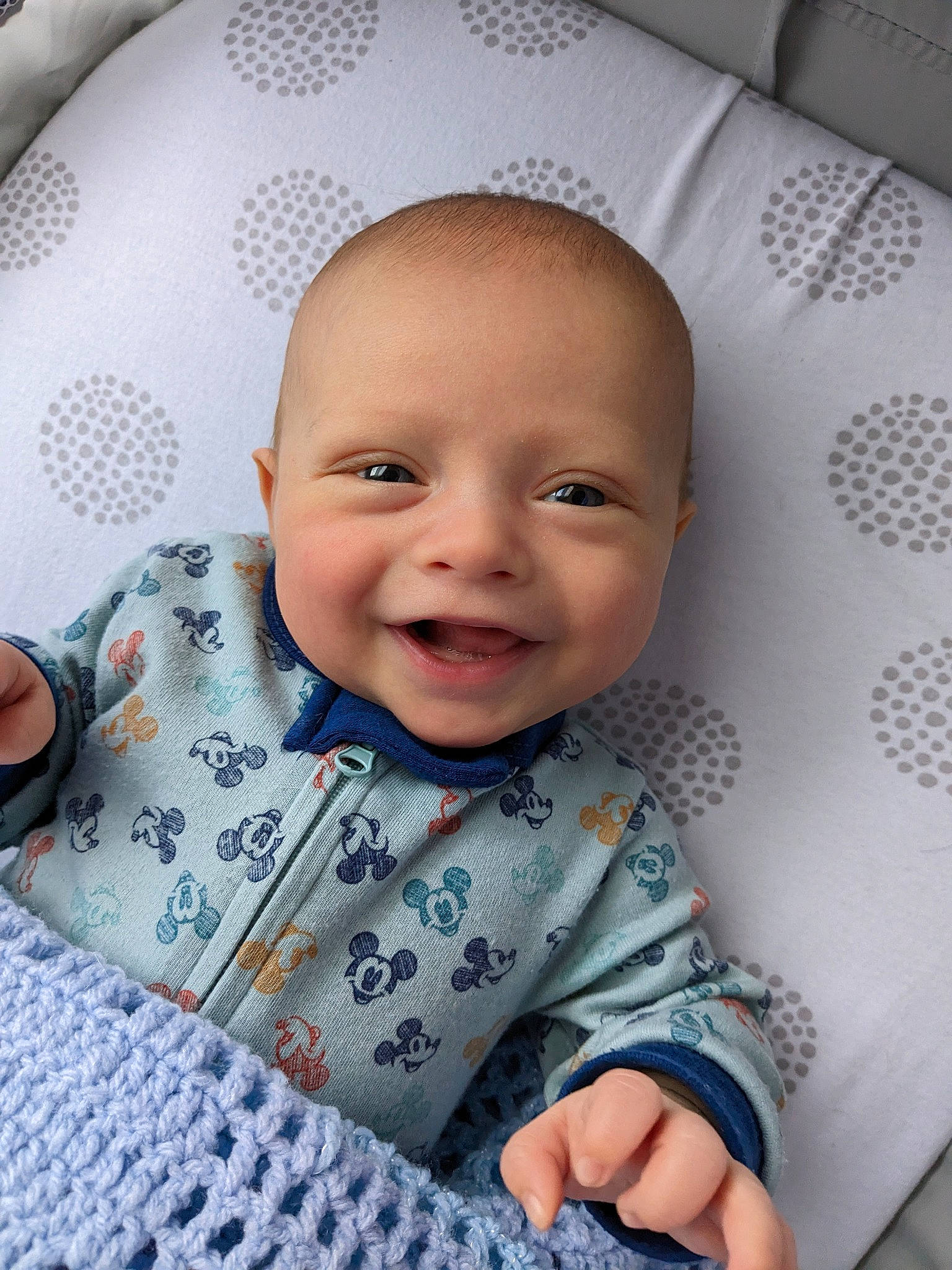 Koda is registered to the contest to win money with this photo: baby, baby_laughing, baby_products, baby_toddler_clothing, bedding, cheek, child, comfort, fun, happy, joy, linens, magenta, nose, pattern, person, room, skin, sleeve, smile