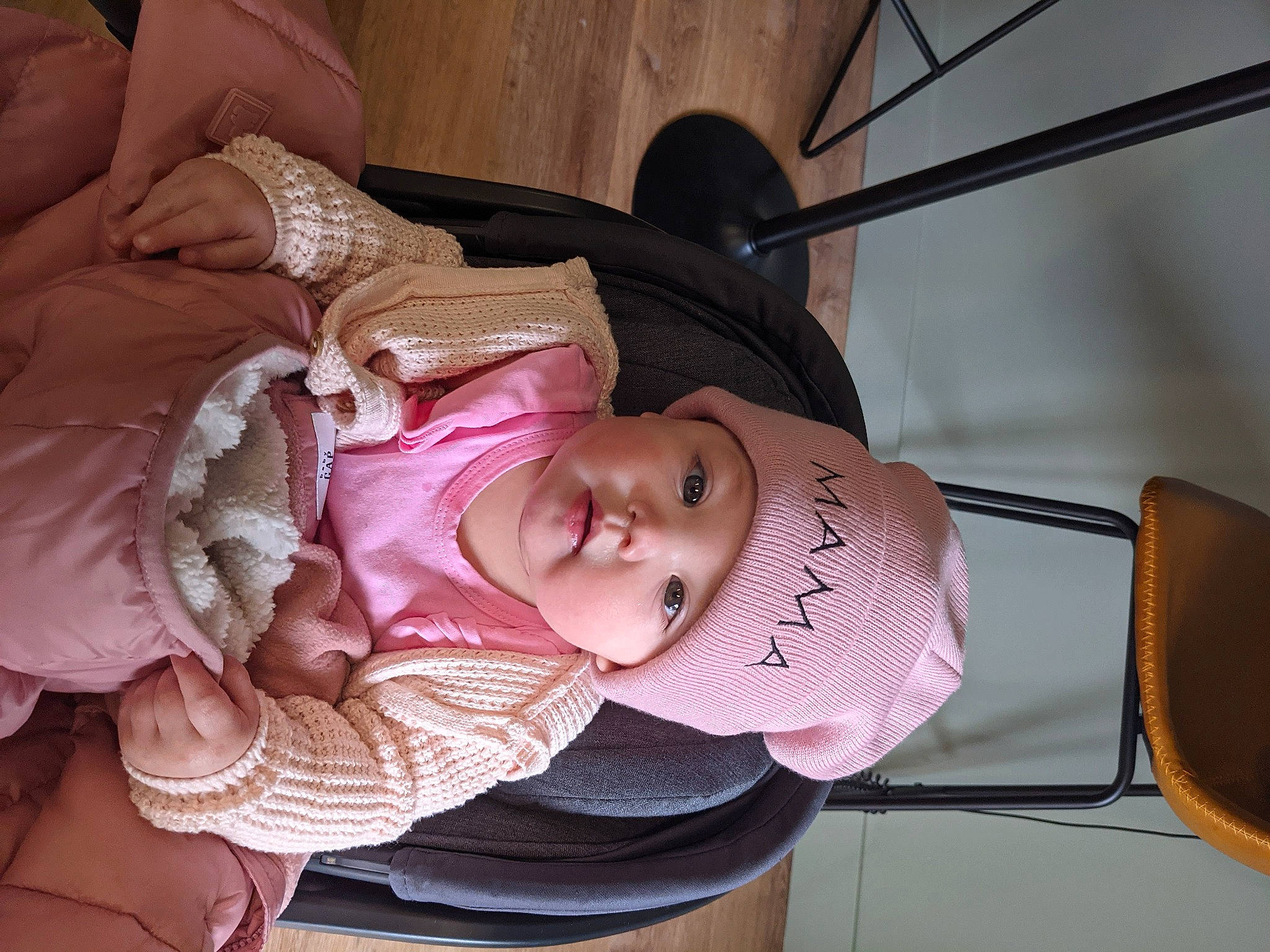 Gwynneth is registered to the contest to win money with this photo: baby, baby_carriage, baby_products, baby_toddler_clothing, cheek, child, comfort, eyelash, fashion_accessory, hat, headgear, headwear, mouth, person, pink, sitting, skin, smile, sun_hat, toddler