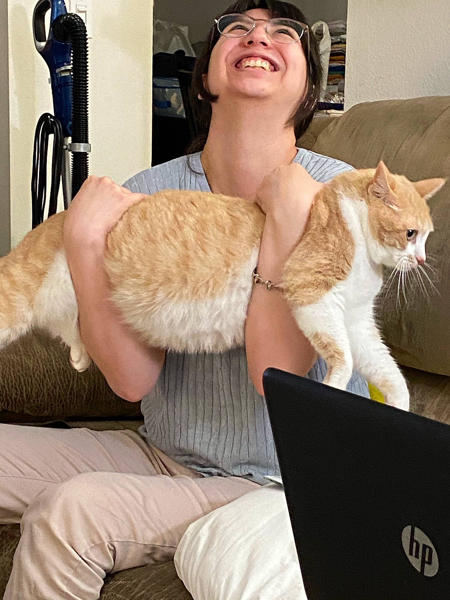 Peanut joined the competition — help win amazing prizes! cat, chair, comfort, elbow, fawn, felidae, finger, fur_clothing, gesture, glasses, human_leg, joint, knee, lap, laptop, neck, smile, thigh, trunk, white