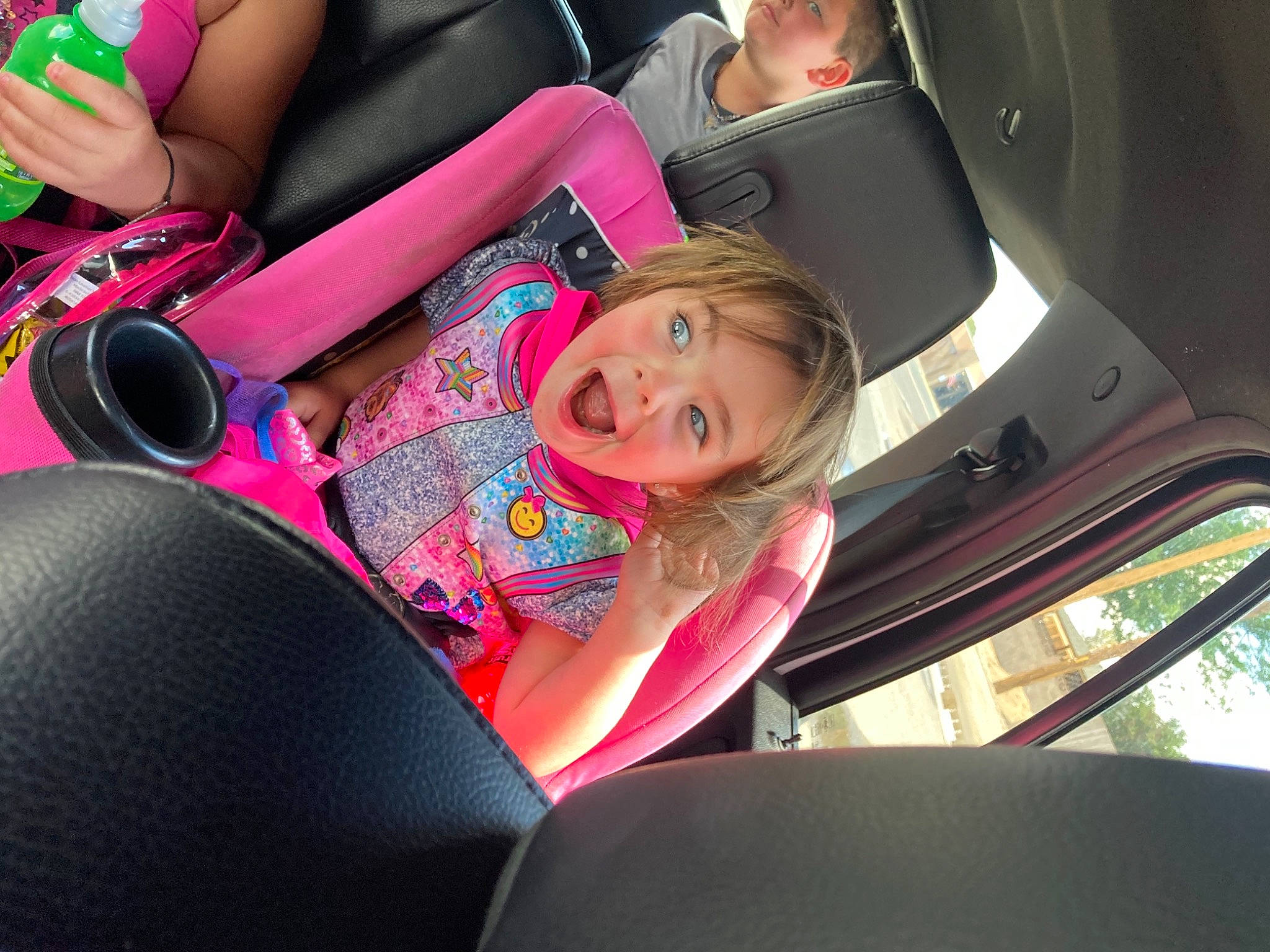 Cassie Pettit is registered to the contest to win money with this photo: auto_part, automotive_design, automotive_exterior, car, car_seat, car_seat_cover, comfort, eyewear, head_restraint, human_leg, leisure, long_hair, motor_vehicle, person, personal_luxury_car, pink, steering_part, steering_wheel, thigh, vehicle