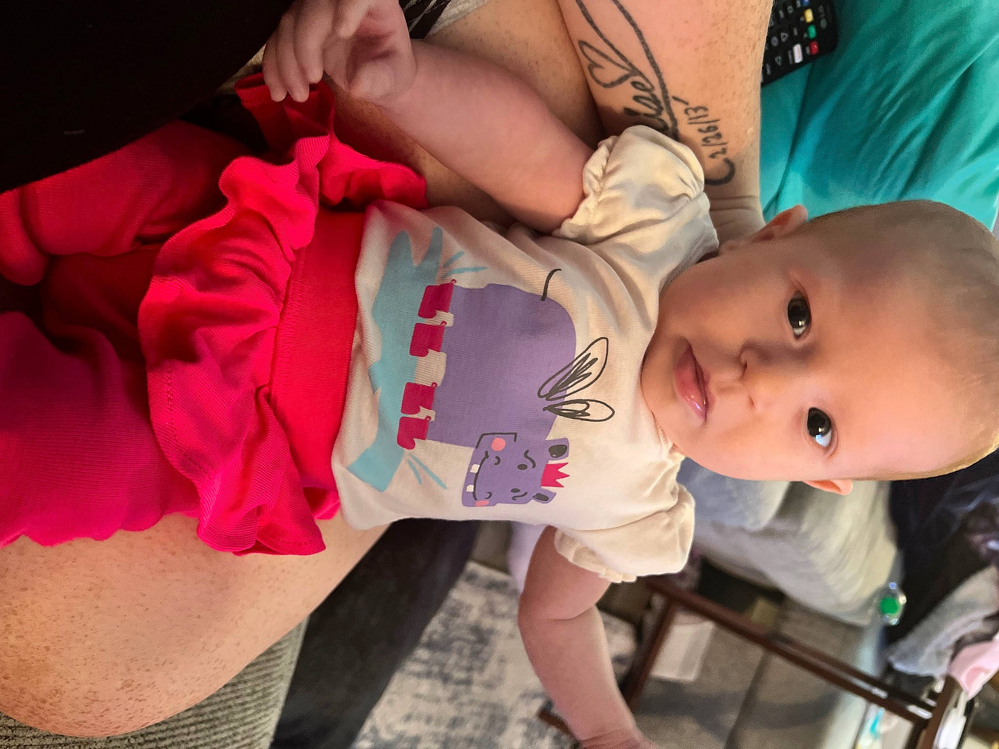 Presley is registered to the contest to win money with this photo: abdomen, arm, baby, baby_toddler_clothing, cheek, chest, clothing, elbow, eyelash, happy, human_body, joint, mouth, organ, person, pink, skin, sleeve, thigh, toddler