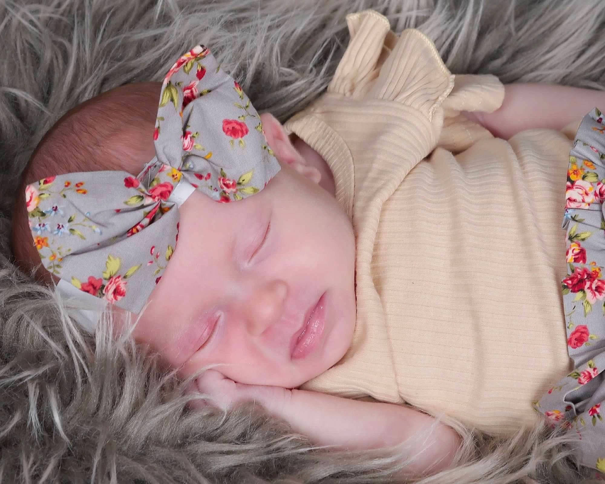 Presley is registered to the contest to win money with this photo: baby, baby_toddler_clothing, cheek, child, comfort, ear, eye, eyelash, grass, hair, head, headwear, iris, linens, lip, nose, person, pink, skin, textile