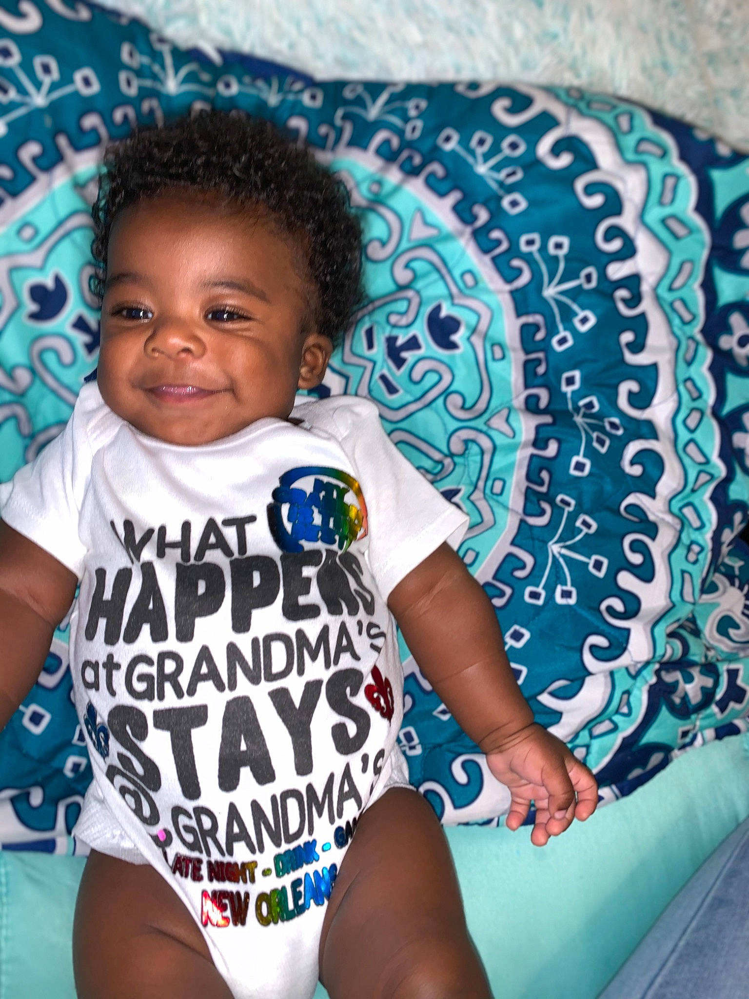 Kamarion is registered to the contest to win money with this photo: aqua, azure, baby_toddler_clothing, black, black_hair, blue, cool, electric_blue, eye, flash_photography, fun, happy, head, joy, leisure, person, skin, sleeve, smile, textile