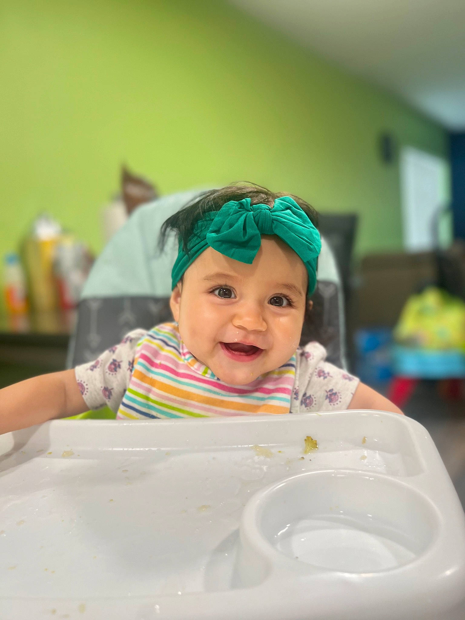 Kamila is registered to the contest to win money with this photo: baby, bib, chair, child, comfort_food, event, fun, happy, hat, headwear, icing, joy, laugh, paint, person, plastic, plate, room, smile, table