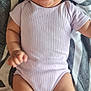 Cassy participe au concours pour gagner de l'argent avec cette photo : baby, blanket, child, chubby_arms, chubby_legs, cute, expression, face, happy, head, indoors, infant, lying_down, onesie, patterned_blanket, person, purple_clothing, skin, smiling, tongue_out
