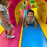 éden a rejoint le concours — aidez-le/la à gagner de superbes lots ! activity, blue, cartoon, child, clothing, colorful, crawling, curious, fun, happy, indoor, inflatable, person, pink, play, playground, smiling, standing, toddler, yellow