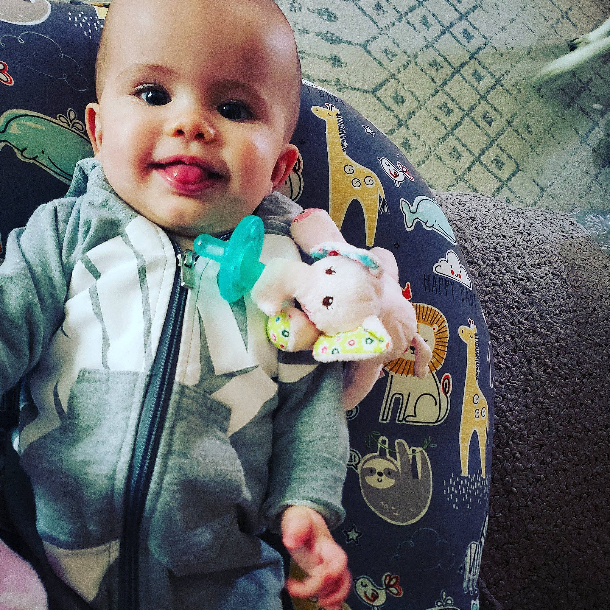 Meadow is registered to the contest to win money with this photo: baby, baby_products, cheek, child, cool, ear, electronic_device, eye, happy, head, hoodie, outerwear, person, play, product, skin, toddler, toy, world