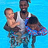 baby, child, clothing, dreadlocks, family, floaties, fun, happy, man, outdoor, parent, people, pool, smile, summer, swimming, swimwear, tank_top, toddler, water